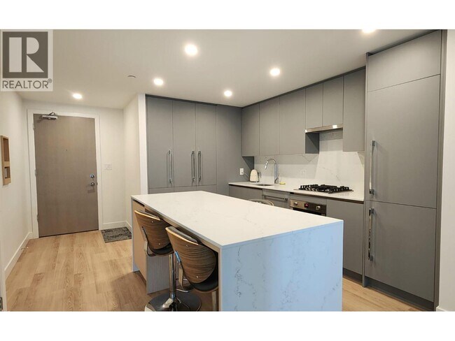 Photo du bâtiment - 5520 McNaughton Rd