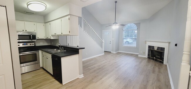 Photo - MODERN NW 3/2 w/ Washer/Dryer, Plank Vinyl Floors, Deck, & Vaulted Ceilings! Available NOW for $1... Townhome