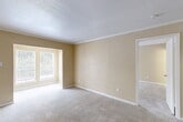 Located at 15530 Ella Blvd in Houston, TX, this single-floor, one-bedroom, one-bathroom unit offers a practical and efficiently designed layout. The entrance opens into a well-organized floor plan that includes a combined kitchen and living room, two closets, a pantry, a bonus room, and a full bathroom.

The open-concept living area is finished with soft, neutral-toned walls and plush carpeting that runs throughout the main spaces, creating a warm and cohesive atmosphere. Large windows allow natural light to filter in, offering pleasant outdoor views of surrounding greenery. Crown molding and textured ceilings add a subtle architectural detail to the living room.

The galley-style kitchen is a functional highlight, featuring white cabinetry, dark granite-style countertops, black appliances including a range and refrigerator, a double stainless steel sink, and rich hardwood flooring — a clean contrast to the carpeted living spaces.

The bedroom is a comfortable, well-proportioned space with carpeted floors, neutral walls, and a large window that brings in natural light. Two closets provide ample storage throughout the unit, along with a dedicated pantry adjacent to the kitchen.

The bathroom is finished in white with a combined tub and shower, complemented by hardwood flooring and clean, simple fixtures. A bonus room adds versatile additional space suitable for a home office or storage.