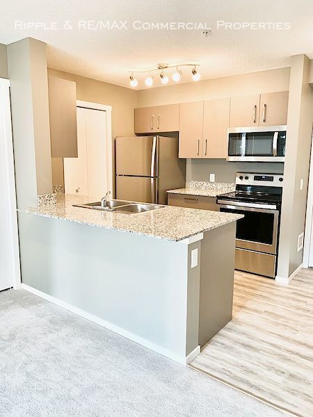 Photo du bâtiment - 4641-4128 128 Ave NE