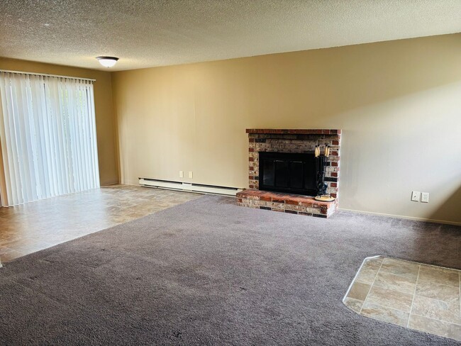 Building Photo - Bright 2 BR Carter Park Living with Fireplace, Carport, and Tons of Storage!