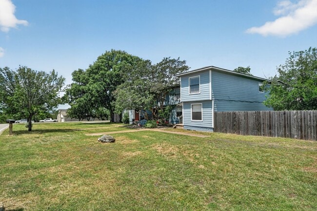 Building Photo - 2 Weeks Free! Spacious 4BR Townhome with Fenced Yard in Lago Vista