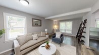 Located at 640 Limerick Way in Hyattsville, MD, this two-story home offers a well-designed layout spread across two comfortable floors. The main level features a bright and welcoming living room with hardwood-style flooring, neutral gray walls, and multiple windows that invite abundant natural light. An exposed beam adds architectural character to the space. The adjacent dining area flows seamlessly into a modern kitchen outfitted with white shaker cabinets, dark granite countertops, stainless steel appliances, and a peninsula with bar seating — ideal for casual dining or entertaining. Upstairs, the primary bedroom is a generous retreat with plush carpeting, a ceiling fan, and ample space. The second bedroom features soft carpeting and a window with leafy outdoor views, creating a calm atmosphere. A dedicated office provides a quiet workspace complete with built-in shelving and natural light. Three well-appointed bathrooms feature white vanities topped with granite countertops and polished chrome fixtures. Laundry facilities are conveniently available on both floors. Throughout the home, a cohesive palette of soft grays and warm wood tones creates a clean, modern aesthetic that is both functional and inviting.