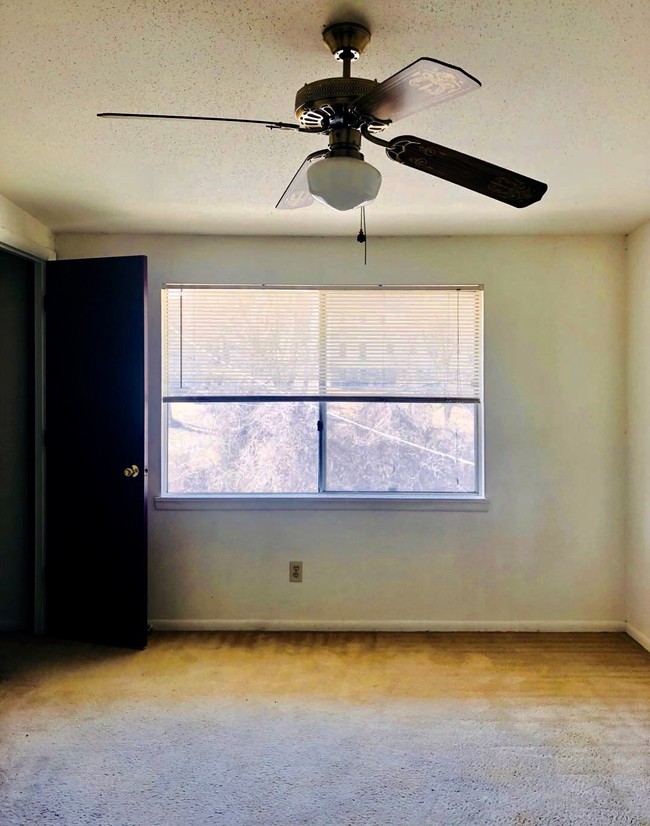 Bedroom w/ walk-in closet - Dellwood Apartments