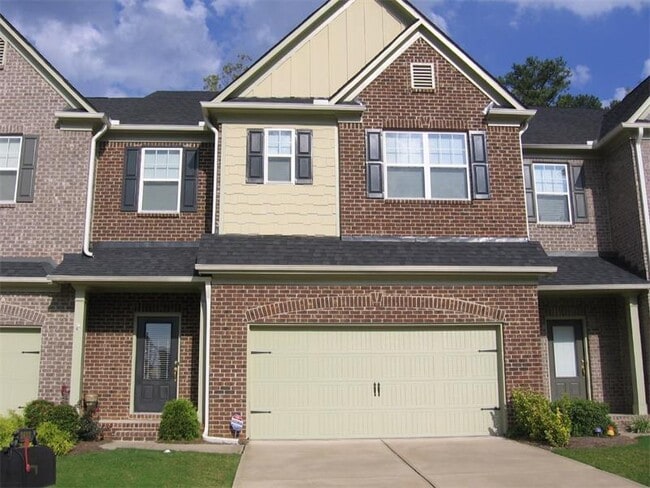 Front of townhome. Parking for two cars in garage. - 3633 Ashcroft Bend Townhome
