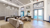 This expansive single-floor amenity space showcases a seamlessly connected series of refined zones, each defined by distinctive architectural detailing and high-end finishes. The grand entrance corridor sets a strong first impression, featuring large-format stone-look tile flooring with inlay accents, floor-to-ceiling mirrors framed in dark trim, curated wall art, and recessed cove lighting that guides visitors inward.

The main lobby opens dramatically with soaring ceilings, dual marble-topped reception islands, and coffered ceiling details illuminated by cove and recessed lighting. Polished tile floors continue throughout, while blue-toned artwork and a round accent mirror add visual interest to the neutral palette.

Adjacent lounge areas transition to warm herringbone hardwood flooring, featuring plush seating arrangements, sculptural side tables, and a striking veined marble fireplace surround. Floor-to-ceiling glazed walls flood the space with natural light and offer views of an outdoor terrace and pool area.

A dedicated lounge and dining zone features upholstered banquette seating set against tall padded wall panels, accompanied by globe pendant chandeliers, round tables, and dark wood chairs. Throughout, layered lighting, large mirrors, and a cohesive neutral color scheme create a polished, welcoming atmosphere.