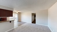 Located at 46896 Jefferson St in Indio, CA, this single-story home offers three bedrooms and four bathrooms within a well-utilized floor plan. The combined kitchen and living room serves as the heart of the home, with the living area featuring durable wood-look flooring, a ceiling fan, and sliding glass door access to an outdoor space. The kitchen is appointed with rich dark wood cabinetry, granite-look countertops, black appliances including a gas range and refrigerator, and a window above the sink that brings in natural light.

The three bedrooms are carpeted and finished in neutral tones, each offering a comfortable and quiet retreat. The primary bedroom includes a mirrored sliding closet, maximizing both storage and the sense of space. The bathrooms are functional and clean, featuring white tub-shower combos and dedicated stand-up showers, along with vanities topped with granite-style counters and dark wood cabinetry. One bathroom showcases a double-sink vanity with wood-look flooring, adding a refined touch.

Throughout the home, textured ceilings, neutral wall colors, and consistent finishes create a cohesive and practical living environment suited for everyday comfort in the Indio desert climate.