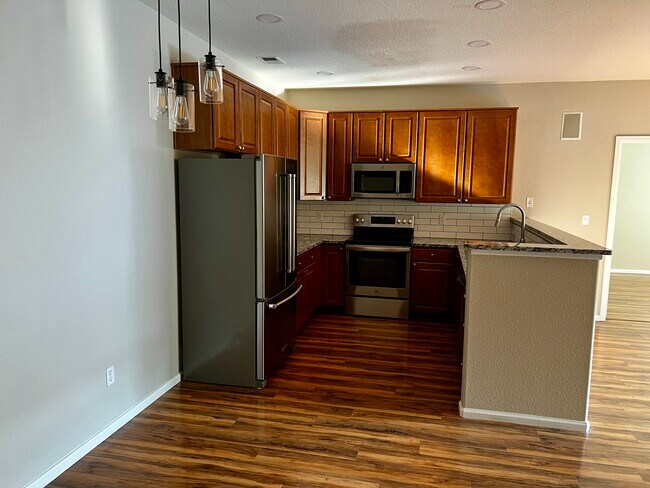 Dining Area and Kitchen - 8200 E 8th Ave