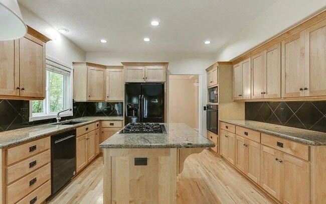 Building Photo - Spacious Four-Bedroom Home with Gourmet Kitchen, Multiple Living Areas, Loft, and Beautifully Lan...