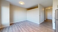 Located at 540 Revere Beach Blvd in Revere, MA, this efficiently designed single-floor unit offers a thoughtful layout that maximizes every square foot. The space features warm hardwood-style flooring that runs throughout, creating a cohesive and inviting atmosphere.

The kitchen is a standout feature, outfitted with a full suite of stainless steel appliances including a refrigerator, electric range, over-the-range microwave, and dishwasher. Crisp white cabinetry extends to the ceiling for generous storage, while a striking blue mosaic tile backsplash adds a vibrant design accent. Light-toned countertops and a built-in sink complete the modern, functional workspace. Track lighting overhead ensures excellent task illumination.

The living area is bright and open, with neutral warm-toned walls and a window that allows natural light to fill the space. The clean lines and minimalist design give the room a versatile, move-in-ready feel.

The bathroom is finished to a high standard, featuring a glass-enclosed walk-in shower clad in classic white subway tiles with chrome fixtures and hardware. Light stone-look tile flooring adds a refined touch, while the overall design balances practicality with contemporary style. Together, these spaces form a cohesive, modern unit ideal for comfortable everyday living.