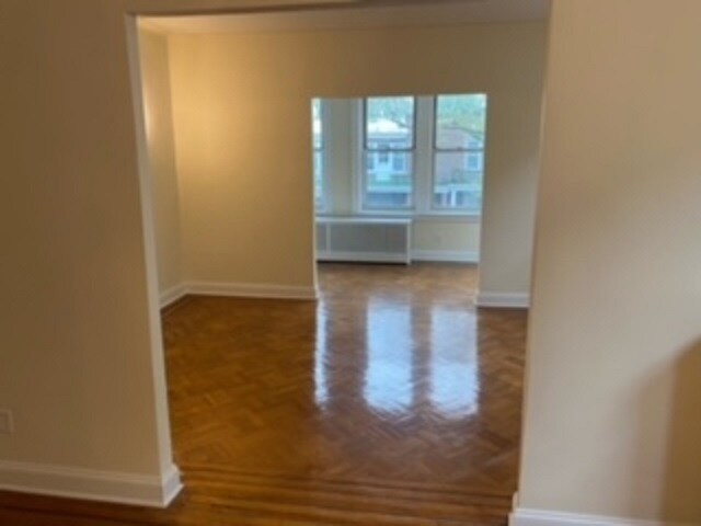living room and entrance to sun room - 234 91st St