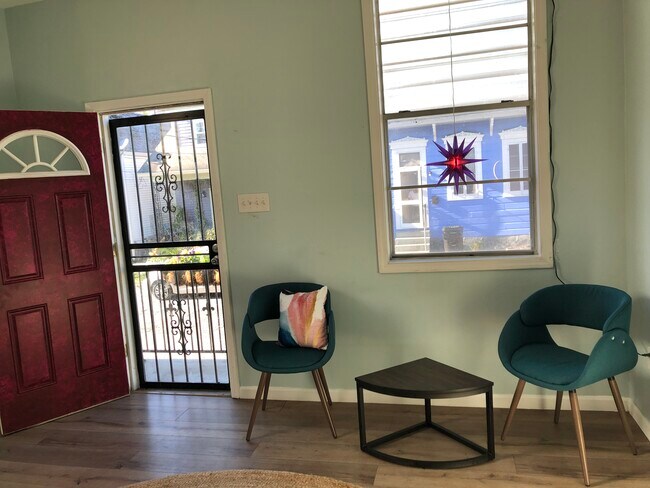Living room has a new Ashley sofa bed - 1534 N Roman St