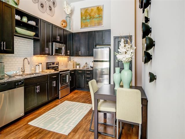 Model Kitchen with High Ceilings - The Flats at Taylor Place