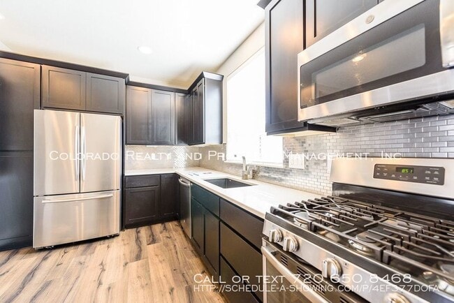 Foto del edificio - 9014 E 49th Pl