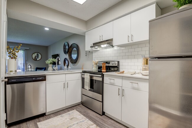 Newly Renovated Kitchen with Stainless Steel Appliances - The Invitational Apartments