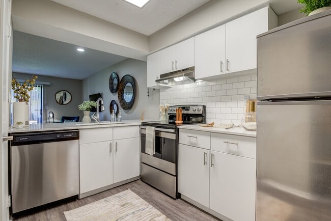 Renovated Kitchen with Stainless Steel Appliances - The Invitational Apartments