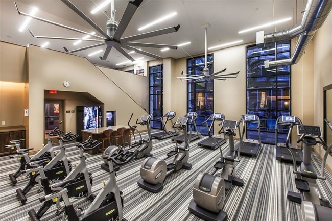 Two-level fitness center features cardio studio - The Verdant Apartments