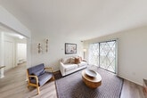 Located at 303 Smith St in Clio, Michigan, this single-floor 1-bedroom, 1-bathroom residence offers a thoughtfully organized layout across a compact and efficient footprint. The inviting living room serves as the heart of the home, featuring light wood-style flooring, neutral white walls, and a large sliding glass door fitted with vertical blinds that floods the space with natural light and provides direct outdoor access. The combined kitchen and dining area is outfitted with crisp white shaker-style cabinetry, light stone-look countertops, a stainless steel dishwasher, and an electric range, creating a clean and functional workspace. The bedroom is a comfortable retreat, benefiting from natural light through a window with vertical blinds, hardwood-style flooring, and a large bifold closet offering generous storage. Throughout the unit, four closets in total ensure ample storage solutions. The full bathroom features a white vanity with integrated sink, a framed mirror, and a tub/shower combination. A welcoming entryway with wood-look flooring and a hallway connecting the main spaces completes this efficiently designed residence, ideal for those seeking a functional and cozy home in Clio, MI.