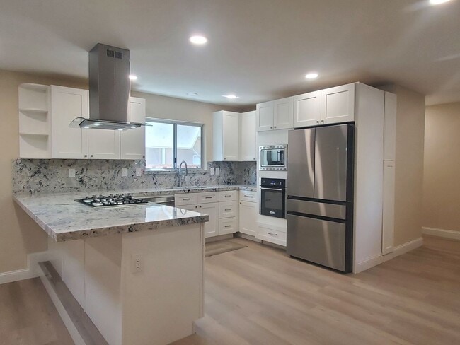 Building Photo - Remodeled Home, Beautiful Landscaping, A/C...