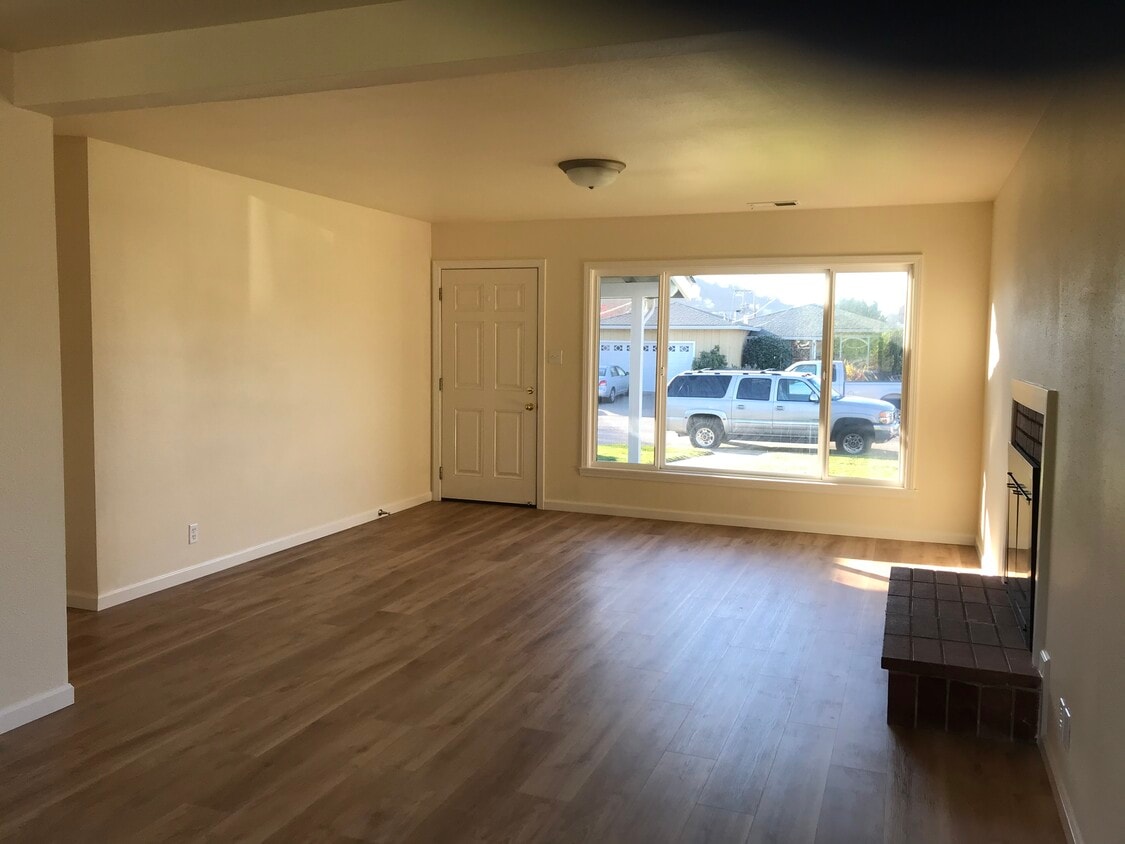 Living room with large window. - 20 Cadiz Ct.