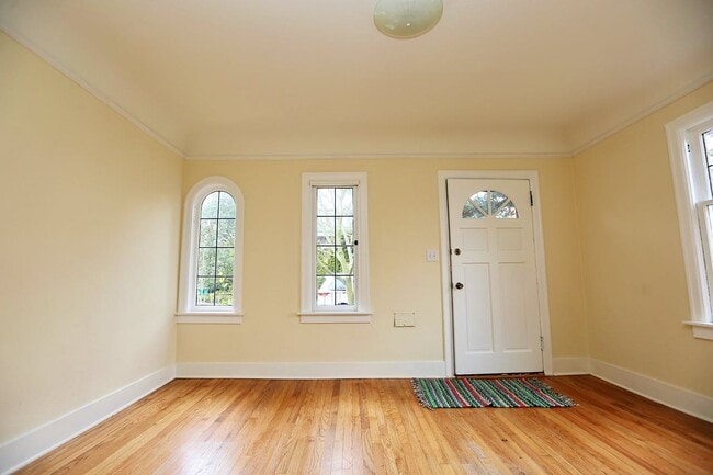 Lovely living room filled with lots of natural light & hardwood floors! - 3034 26th Ave W