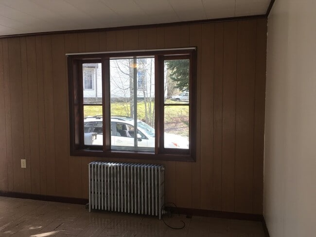 View out Living Room looking toward private parking area. - 16 Obrien Ave