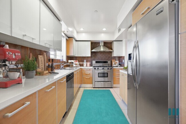 Full-Size Kitchen with Wnergy-Efficient Refrigerator, Stove, Microwave Oven, and Dishwasher - Brockton Palace by Wiseman