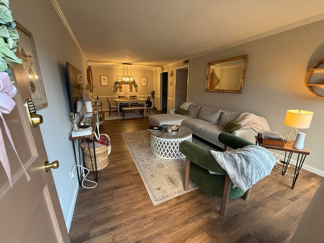 Open-concept living to dining room. (Unit does not come furnished) - 1177 Church St