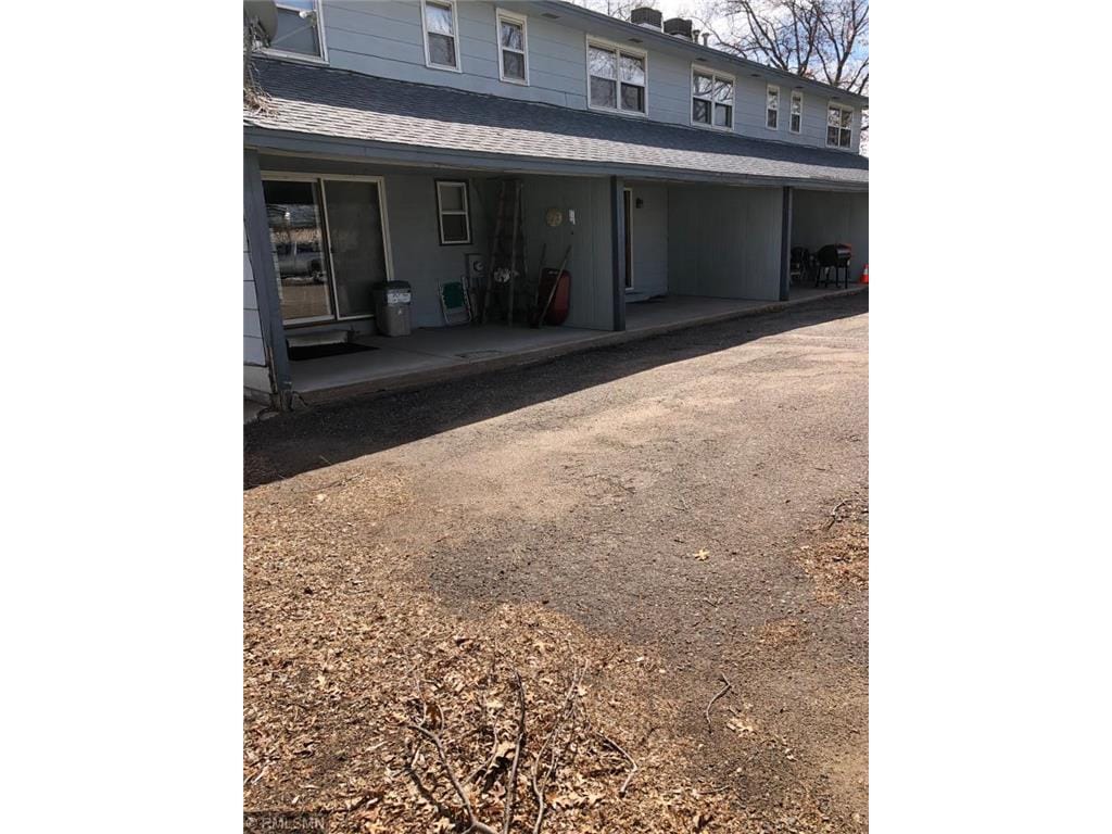 Back of building. Covered pourch - 23100 Ambassador Blvd NW