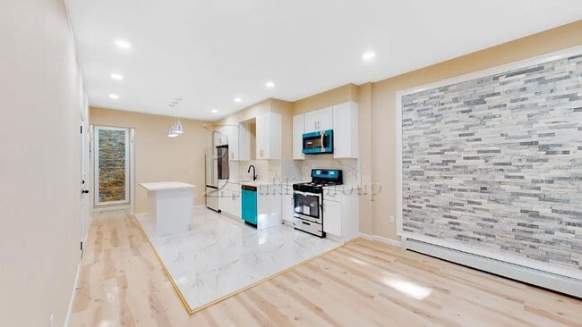 Photo - ** GUT RENOVATED ** 3 BEDROOM ** PRIME ASTORIA ** 2 MIN TO N/W Townhome