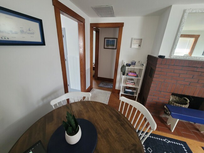 Dining area, bookcase and doorway to bedroom hallway and bathroom - 116 15th St