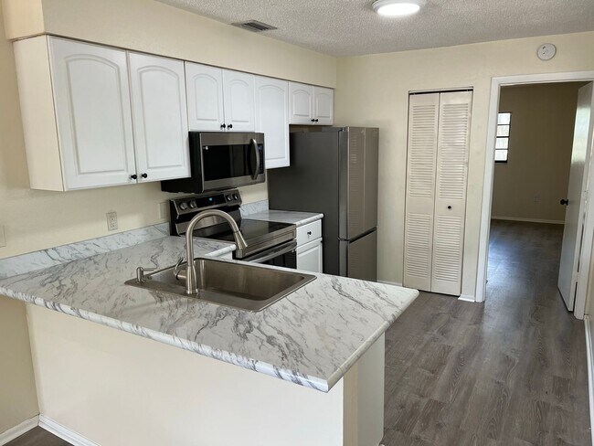 Building Photo - Annual 3 Bedroom 2 bath Duplex available F...