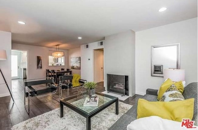View of Living room area and open dining area - 1606 S Barrington Ave