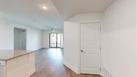 Located at 4129 Agualinda Blvd in Cape Coral, Florida, this single-floor, 3-bedroom, 2-bathroom home offers a well-designed layout with a clean, modern aesthetic throughout. The open-concept kitchen and living area serves as the heart of the home, showcasing white shaker cabinetry, granite countertops, a central island, stainless steel appliances, and recessed lighting. Wood-look flooring flows seamlessly throughout the space, adding warmth and continuity. The living room is bright and airy, featuring a ceiling fan and large sliding glass doors that open to a private balcony, allowing natural light to pour in. The primary bedroom provides a comfortable retreat, complete with a walk-in closet outfitted with wire shelving for ample storage. The bathrooms are finished with granite vanity tops and wood-look flooring, with at least one bathroom featuring a glass-enclosed walk-in shower with white tile surround. A dedicated laundry room houses a full-size washer and dryer with overhead wire shelving. The hallway connects the bedrooms efficiently, and crisp white walls throughout create a bright, neutral canvas. This well-appointed home combines functional living spaces with modern finishes in a desirable Cape Coral location.