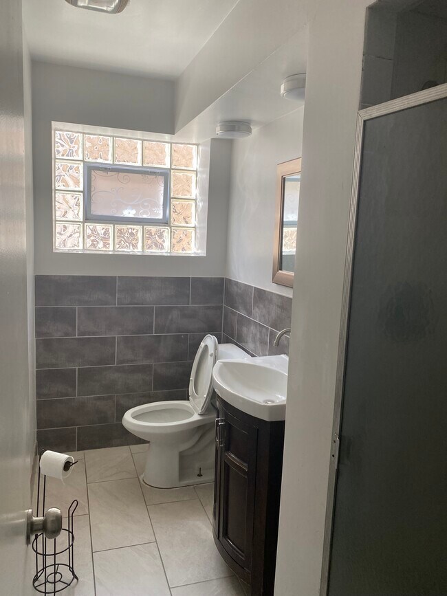 1st bath - 6107 N Mozart St