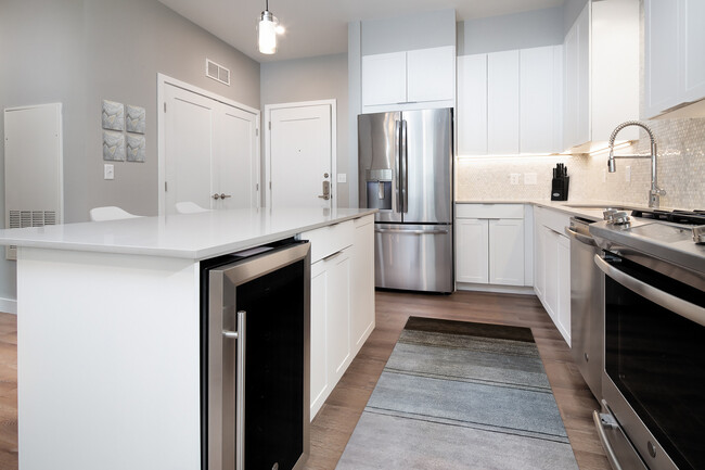 Signature Collection Kitchen with wine refrigerator - Avalon Residences at the Hingham Shipyard