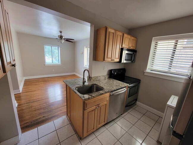 Kitchen view to dining - 100 Newburn Dr