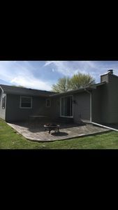 Back of house and stamped concrete patio - 704 Coralyn Dr