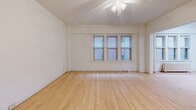 This 630 square foot apartment in Milwaukee, WI, presents a well-designed living space on a single floor. The unit features one bedroom (140 sq ft) and one bathroom, ideal for single occupants or couples. The living room is spacious and bright, with multiple windows allowing natural light to flood the area. Hardwood floors run throughout, adding warmth and character to the space.

The kitchen has been updated with modern amenities, including white cabinetry, stainless steel appliances, and granite countertops. A breakfast bar provides additional counter space and casual dining options. The bathroom, though compact, is efficiently designed with white fixtures and a shower/tub combination.

The bedroom offers ample space and includes a closet for storage. Additional features include a hallway for improved flow, a separate entrance area, and ceiling fans for improved air circulation. The apartment's layout maximizes the use of space, creating a comfortable and functional living environment.

Located at 913 E Kilbourn Ave, this apartment offers urban living in a classic setting. The well-maintained interior and thoughtful updates make this compact space feel larger than its square footage suggests, providing a cozy yet practical home in the heart of Milwaukee.