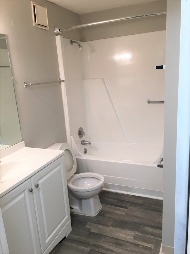 Bathroom in renovated unit. - Village at Iris Glen