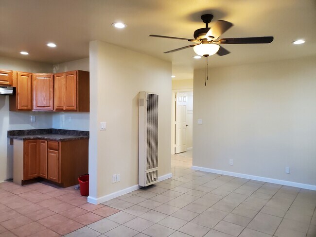 Open Space Living Room Dining Area With Ceiling Fan - 120 E Maple St