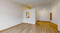 Located at 930 King Rd in Newark, Ohio, this single-floor, 2-bedroom, 3-bathroom home offers a thoughtfully laid-out floor plan across a comfortable footprint. The open living room is a standout feature, boasting vaulted ceilings that lend an airy, spacious feel, complemented by warm light wood laminate flooring and a ceiling fan overhead. Track lighting adds a functional touch, while a distinctive pass-through window connects the living area to the kitchen, enhancing the open flow between spaces. The kitchen features rich wood-accented cabinetry with white panels, light countertops, a built-in dishwasher, and a window that brings in natural light. The entry area is finished with light wood flooring and provides convenient access to the main living space. The two bedrooms are carpeted for comfort, with the primary bedroom offering a generous amount of space and a window with blinds. The bathrooms are finished with light wood-style flooring, full tub-shower combinations with decorative surrounds, and vanities with ample countertop space. A dedicated closet and hallway complete the interior layout, providing practical storage and connectivity throughout the home.
