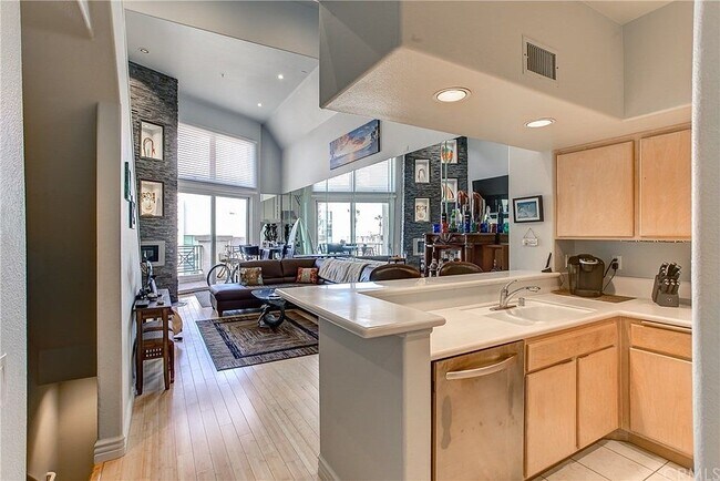 Open kitchen looking into living room. - 200 Pacific Coast Hwy