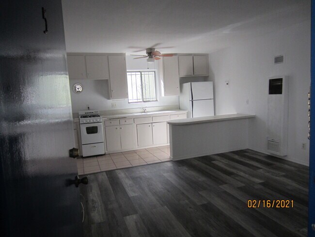 Front room and kitchen - 10946 National Blvd
