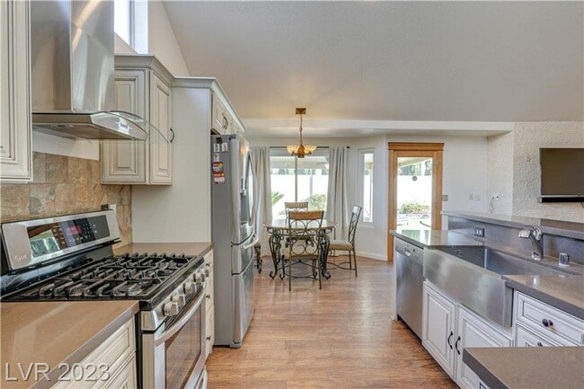 Building Photo - 4 BEDROOM HOME WITH PRIMARY BEDROOM DOWNST...