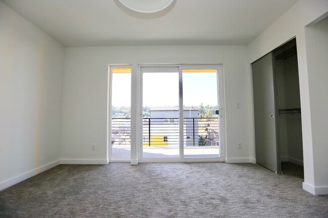 Beautiful bedroom with new carpet & french door deck access! - 1918 24th Ave S