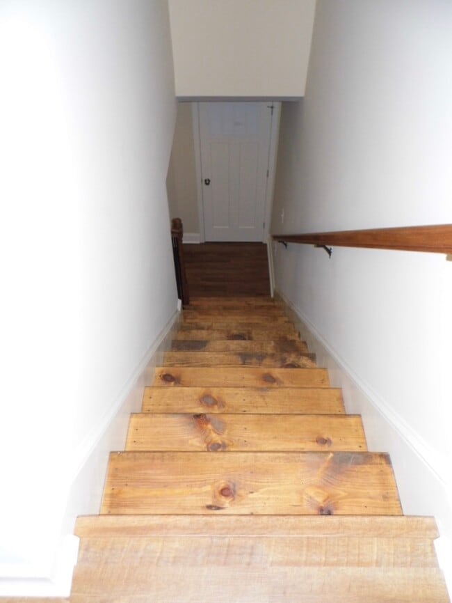 Beautiful hardwood stairs lead to the temperate sleeping and bathing area - 2312-A Belle Ave NE