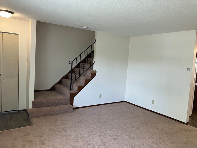 Living room going up to bedrooms and full bath - 4357 45th Ave N