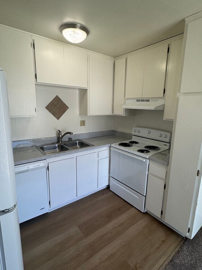 Building Photo - Upstairs two-bedroom 1/12 bath condo avail...