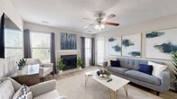 Located at 455 Arbor Pl in Nashville, TN, this well-designed single-floor, one-bedroom, one-bathroom home offers a comfortable and stylish living experience. The open-concept living and dining area is bright and welcoming, featuring wood-look flooring, a ceiling fan with light fixture, and a tile-surround fireplace that serves as a natural focal point. Multiple windows allow ample natural light to fill the space, creating an airy atmosphere throughout. The dining area features a pendant light overhead and chair-rail molding along the walls, adding a refined architectural detail. The kitchen is efficiently laid out with white cabinetry, granite countertops, a stainless steel sink, and stainless steel appliances including a refrigerator, range, and dishwasher. The spacious bedroom features plush carpet, a textured ceiling, and sliding glass doors opening onto a private balcony with outdoor seating and pleasant tree-lined views. Two closets provide generous storage. The full bathroom includes a tub-shower combination with tile surround, a vanity with granite countertops, and wood-look tile flooring. A dedicated utility room and hallway complete this thoughtfully organized home.